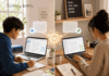 Best Free AI Writing Tools in 2026 (for Students, Bloggers, and Beginners) Illustration of a laptop and notebook with an abstract AI writing assistant on a clean desk.